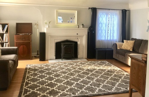 Mississippi District House | Modern English Tudor` with Covered Patio, Fireplace and Fenced yard