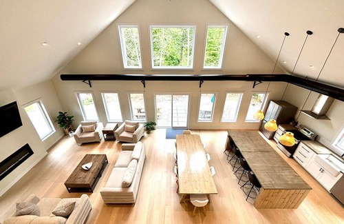Lion's Head House | Modern forest retreat in Stokes Bay! Featuring king beds, cozy bunk rooms, a spacious game loft, firepit, chef’s kitchen, and open-concept living. Perfect for families and groups—close to Bruce Peninsula hiking, beaches, and dark sky stargazing.