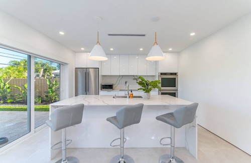 Imperial Point House | Modern Oasis, Heated Pool, Short Drive to Beach