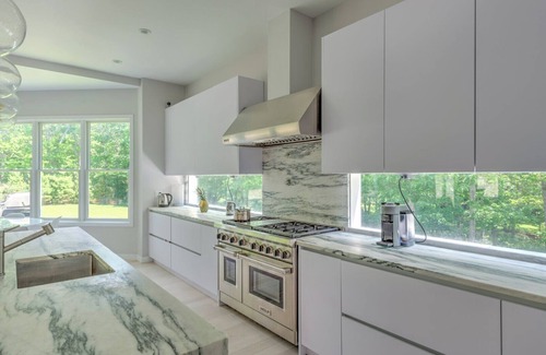Amagansett North House | Modern-style home with heated private pool, open-floor plan, ample natural.