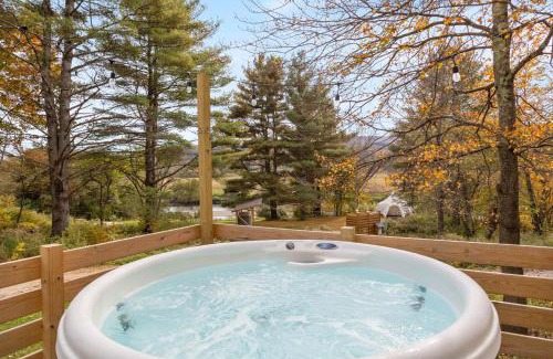 Johnson House | Modern Tiny House with hot tub & river near Stowe