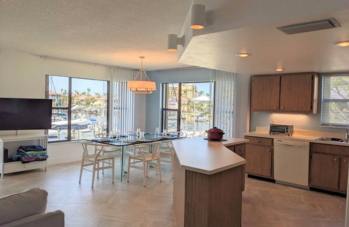 Burnt Store Marina Condo | NEW 2nd floor CORNER condo; PRESTINE MARINA and MANATEE views; many upgrades.