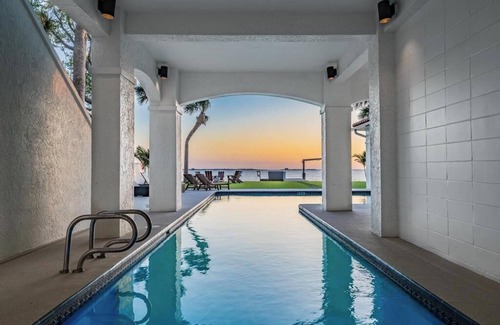 Palm Harbor House | NEW Waterfront 6 bedroom home with large pool and luxurious outdoor living area!