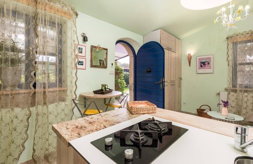 Sveti Ivan Dobrinjski House | On a well-kept and fenced property is this small vacation home with a heated outdoor pool.