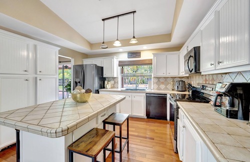 Tamarac House | Palm Tree Paradise House with Private Heated Pool.
