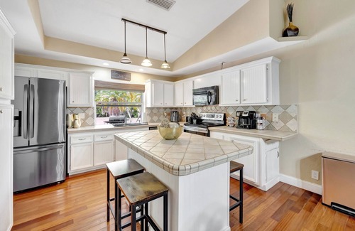 Tamarac House | Palm Tree Paradise House with Private Heated Pool.