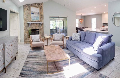 Butler Beach House | Paradise by the River - Relax in Style! New Pool and Heated Spa!