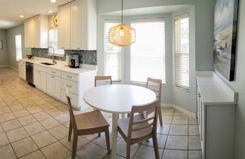 Butler Beach House | Paradise by the River - Relax in Style! New Pool and Heated Spa!