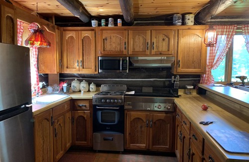 Spooner Cabin | Peaceful retreat on Yellow River. Kayak, canoe or explore our 20 wooded acres!