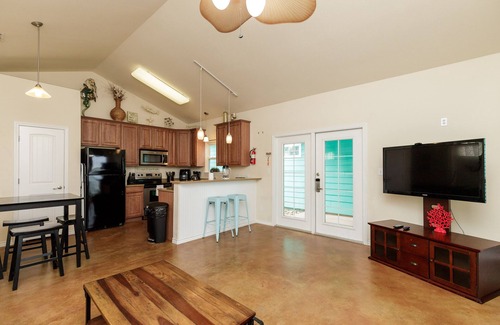 Corpus Christi Cottage | Pet-Friendly Retreat w/a Private Patio, Tropical Pool, & in a Great Location!