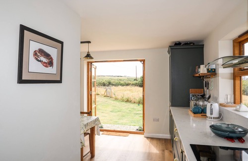 Rhoscolyn Cottage | PLAS COCH RHOSCOLYN, pet friendly, with open fire in Rhoscolyn