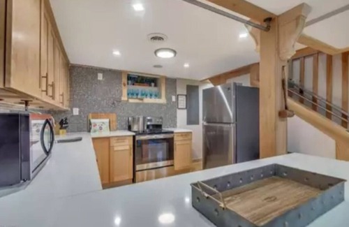 East Stroudsburg House | Poconos Vacation Home For Rent - Riverside Retreat With Inground Pool & Hot Tub.