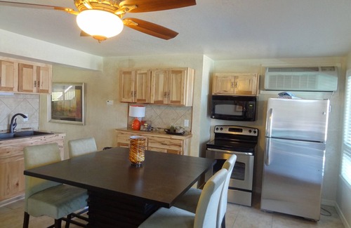 Mount Ida Apartment | Poolside Queen Cabana with two queen beds, full kitchen and pool access overlooking Lake Ouachita. by RedAwning