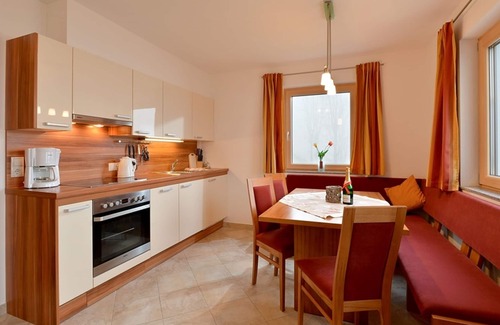 Emberg Apartment | Private garden with barbecue, swing, game house and trampoline