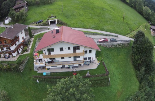 Emberg Apartment | Private garden with barbecue, swing, game house and trampoline