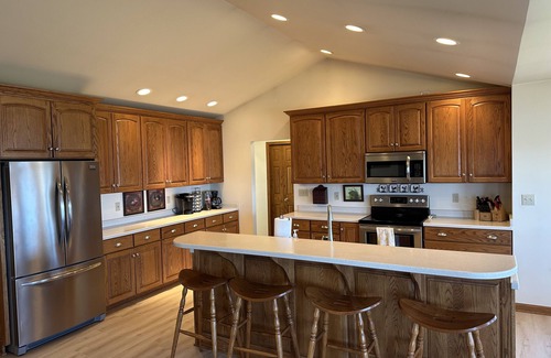 Ludington House | Private Hamlin Lake Water Front Cottage Perfect Family Retreat