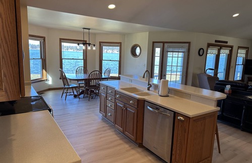 Ludington House | Private Hamlin Lake Water Front Cottage Perfect Family Retreat