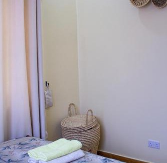 Mbezi Beach House | Private Room in 2-Bedroom Apartment with Shared Spaces