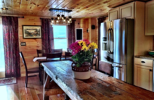 Lochmere Cabin | Private sandy beach, boat slips, canoes, kayaks, paddle boards, dog friendly