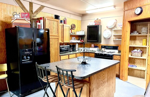 Tahlequah Cabin | Private setting in town with large yard and fire pit! Unique, vintage decor!