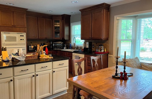Olivia House | Put your feet up, relax and unwind on the screened porch or go jump in the lake!