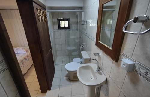 Praia Grande Apartment | Quarto Ipê Rosa