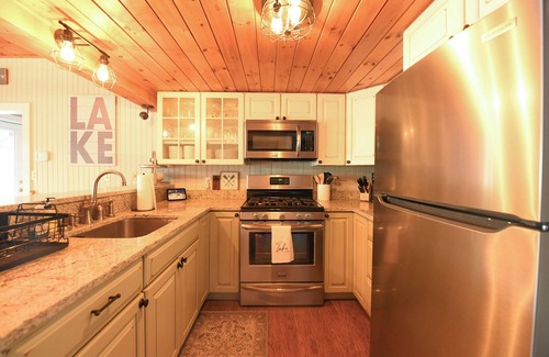 Oxford House | Recently updated home on Thompson Lake with gorgeous sandy beach!