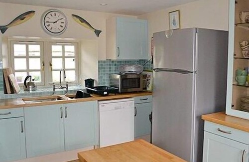 Lairg Cottage | Relax and unwind in this cosy croft house with a woodburner.