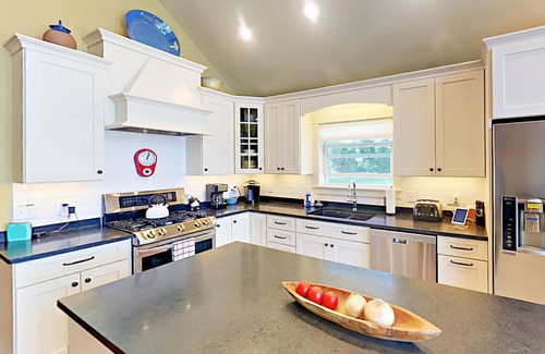 Lamoine Beach Cottage | Renovated waterfront cottage with expansive deck, multiple fireplaces, & grill
