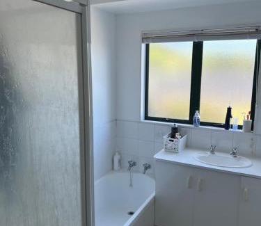 Papamoa Beach House | Room by the beach