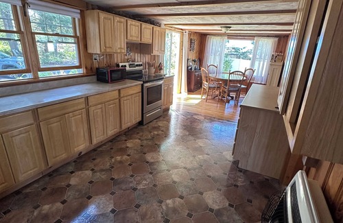 Northwood House | Rustic Lake front cottage nestled in the pines with a Golf Putting Green.