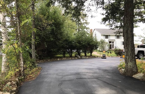 Northwood House | Rustic Lake front cottage nestled in the pines with a Golf Putting Green.