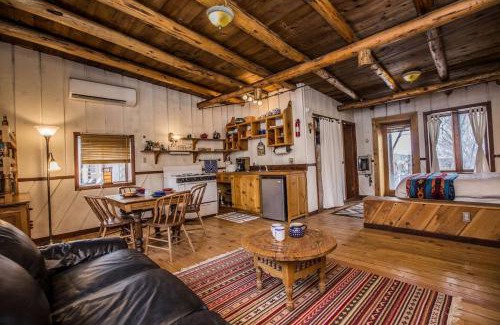 San Cristobal House | Rustic Log Cabin on Eco-Friendly Farm near Taos, New Mexico
