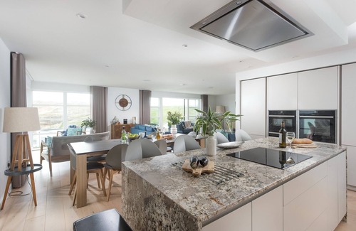 Holywell House | Sandyford - A superb beach house with sea views and parking in an exclusive development overlookin