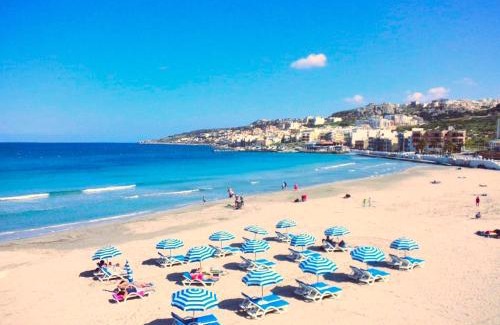 Għadira Apartment | Seafront apartment Terrace, lounger & Panoramic ocean views