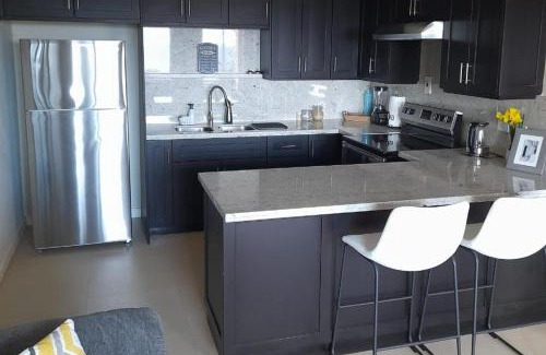 West End Apartment | Seaview Paradise - Sleeps 3 - Pool - Parking