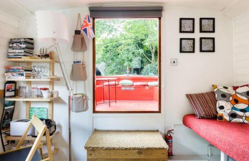Angel Boat Rental | Slash Arts houseboat on secluded mooring in central London