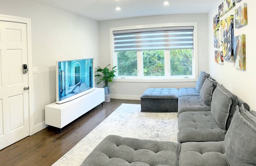 Irving Park Apartment | Sleek 3BR: Minimalist Style, Fire Pit, 65-inch TV, & Tech-Ready!