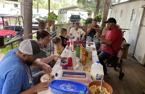 Hugo House | Small one room cabins with no bathrooms hot tub and covered picnic tables.