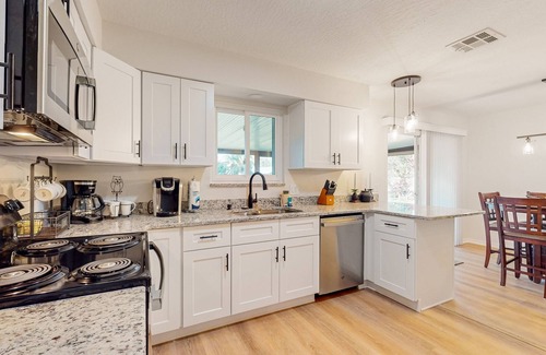 Palm Bay House | Snowbird-friendly home with open layout, enclosed yard, smart TV, AC, & W/D