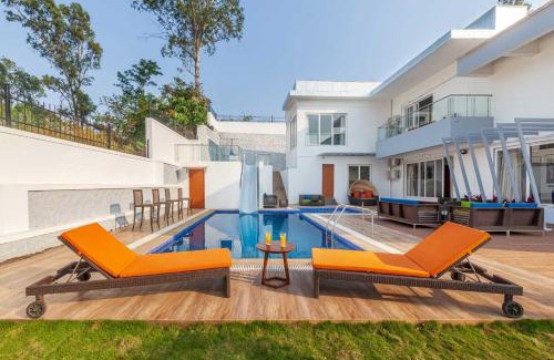 Kune Village Villa | StayVista's White Pebbles - A Villa with Theater Room & Swimming Pool