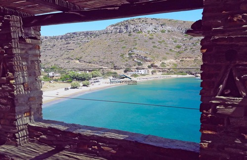 Kea Villa | Stone built waterfront villa with direct access to the sandy beach of Spathi,