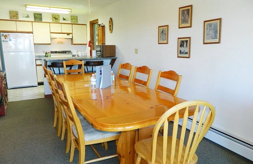 Rangeley House | Stone - This Rangeley Lake home has a very level entry to the water with a huge deck!