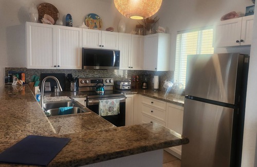 Alice Town Condo | Stunning Caribbean Ocean Views Centrally Located - Golf Cart Optional