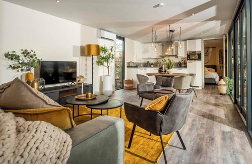 Maasbree House | Stylish and compact hideaway for two with private terrace and large windows, surrounded by forest in North Limburg.