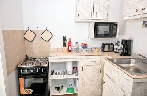 Rock Sound Apartment | Stylish Island Stay| Private Patio + A/C + Wine