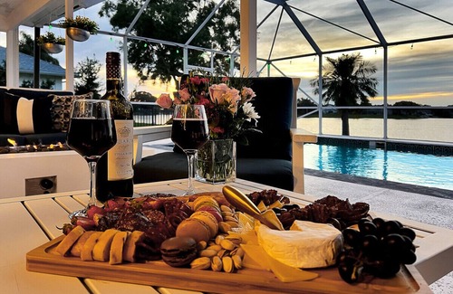 Wellington Villa | Stylish Lake Luxe Equine, on waterfront w screened-in pool - Lake Views! Hosted By Relaxtay