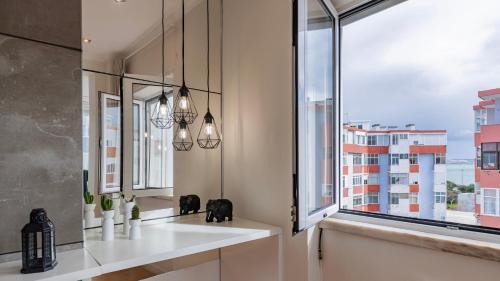 Paco De Arcos Apartment | Sunny Horizon Retreat by LovelyStay