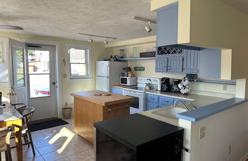 Suttons Bay Cottage | Suttons Bay, in town and steps away from beach - trail, wineries and shopping