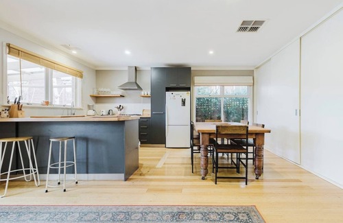 Kensington House | Tangerine Gleam Cheerful Inner City Family Abode